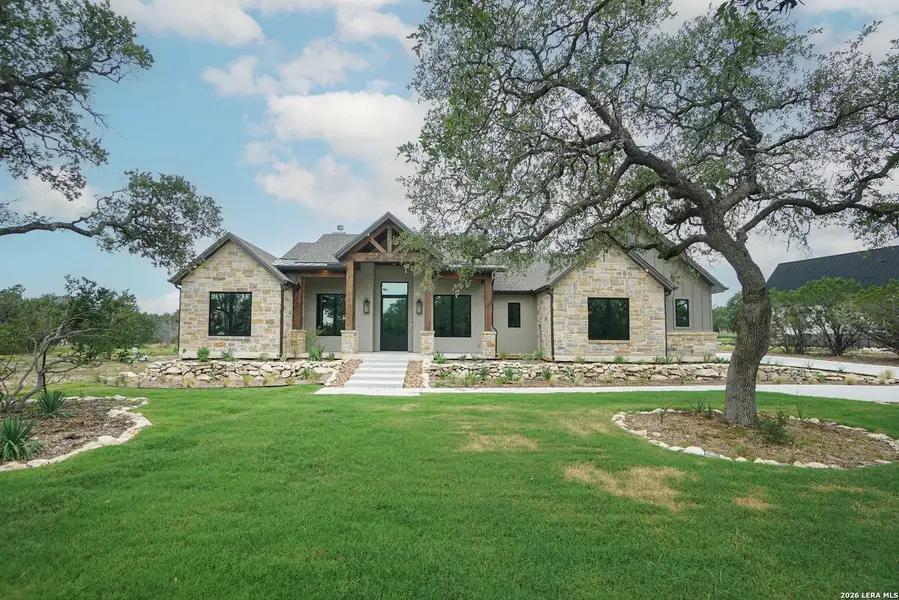 Front exterior of a new home in , Spring Branch, TX, highlighting curb appeal (Image 1). Front exterior of a new home in , Spring Branch, TX, highlighting curb appeal (Image 1).