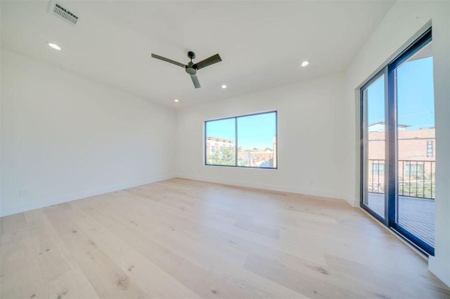 Unfurnished room with light hardwood / wood-style flooring and ceiling fan