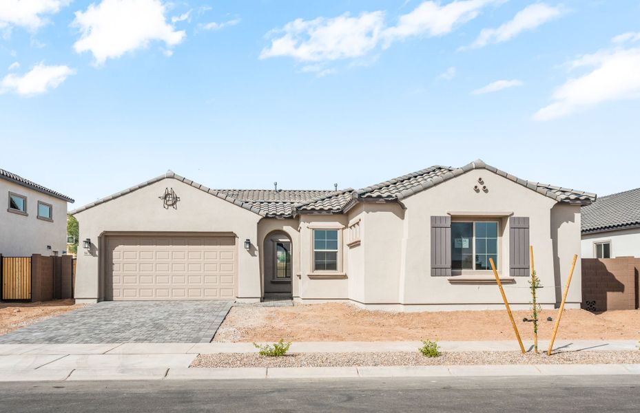 Front exterior of a new home in Artisan at Asante, Surprise, AZ, highlighting curb appeal (Image 1). Front exterior of a new home in Artisan at Asante, Surprise, AZ, highlighting curb appeal (Image 1).