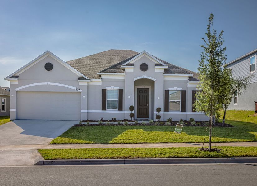 Front exterior of a new home in Malabar Springs, Palm Bay, FL, highlighting curb appeal (Image 25). Front exterior of a new home in Malabar Springs, Palm Bay, FL, highlighting curb appeal (Image 25).