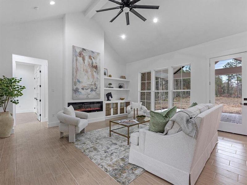 Plenty of natural light flows throughout the home. Electric fireplace, plus built in shelving/cabinets are the show stopper.