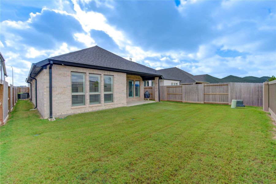Exterior details and patio area of a home in Cross Creek West 45', Fulshear (Image 24). Exterior details and patio area of a home in Cross Creek West 45', Fulshear (Image 24).