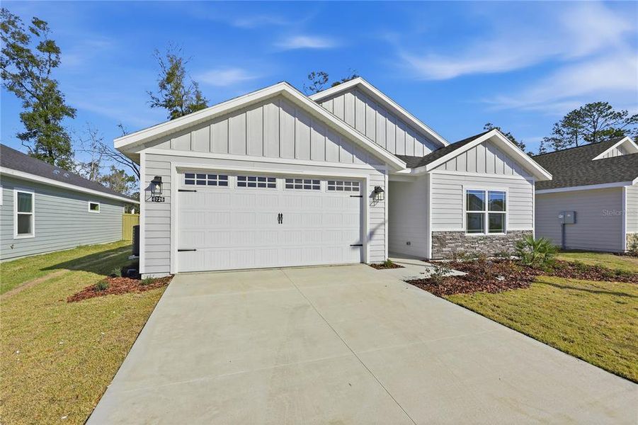 Front exterior of a new home in , Gainesville, FL, highlighting curb appeal (Image 18). Front exterior of a new home in , Gainesville, FL, highlighting curb appeal (Image 18).