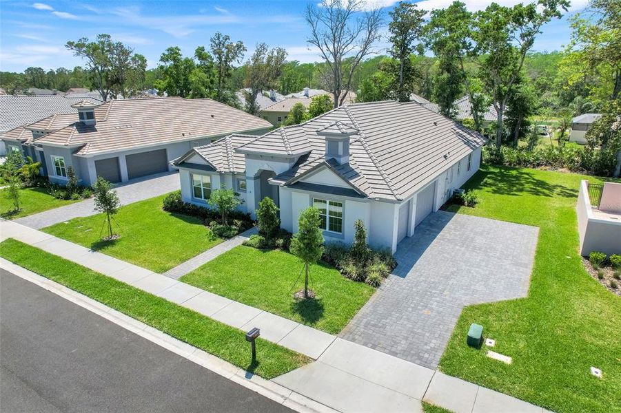 Front exterior of a new home in Toscana, Palm Coast, FL, highlighting curb appeal (Image 2). Front exterior of a new home in Toscana, Palm Coast, FL, highlighting curb appeal (Image 2).