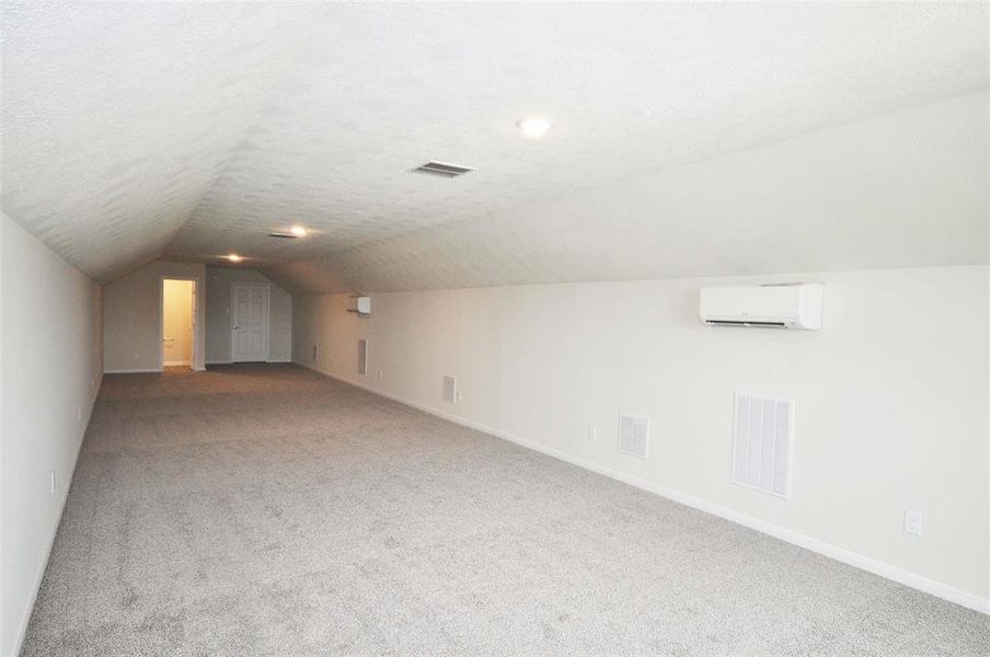 The finished room above the garage includes a 2 piece bath and heated, cooled and spray foam insulated.