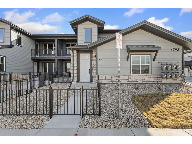 Front exterior of a new home in , Timnath, CO, highlighting curb appeal (Image 2). Front exterior of a new home in , Timnath, CO, highlighting curb appeal (Image 2).