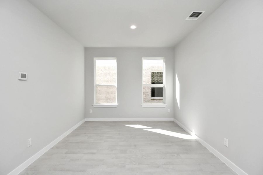 Make memories gathered around the table with your family and friends! This dining spacious room features elegant flooring, custom paint, and adjacent to family room and kitchen for open concept feel. Sample photo of completed home with similar floor plan. Actual colors and selections may vary.
