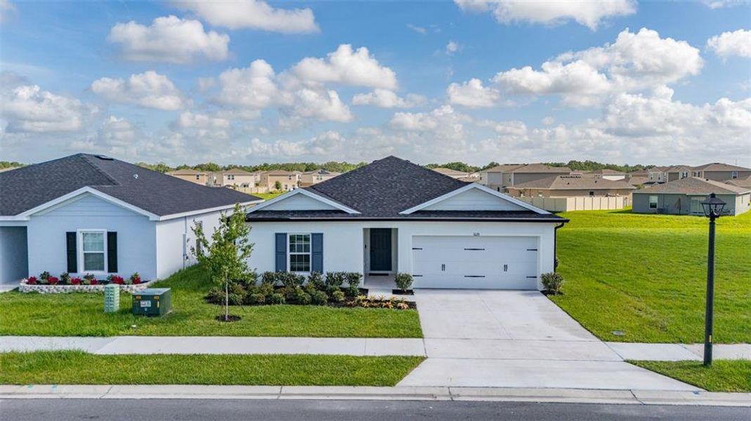 Front exterior of a new home in , Sumterville, FL, highlighting curb appeal (Image 23).