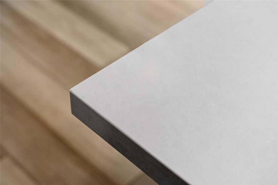 Crisp white quartz countertops complete the contemporary design, offering a stylish and highly functional workspace for any homeowner. Crisp white quartz countertops complete the contemporary design, offering a stylish and highly functional workspace for any homeowner.