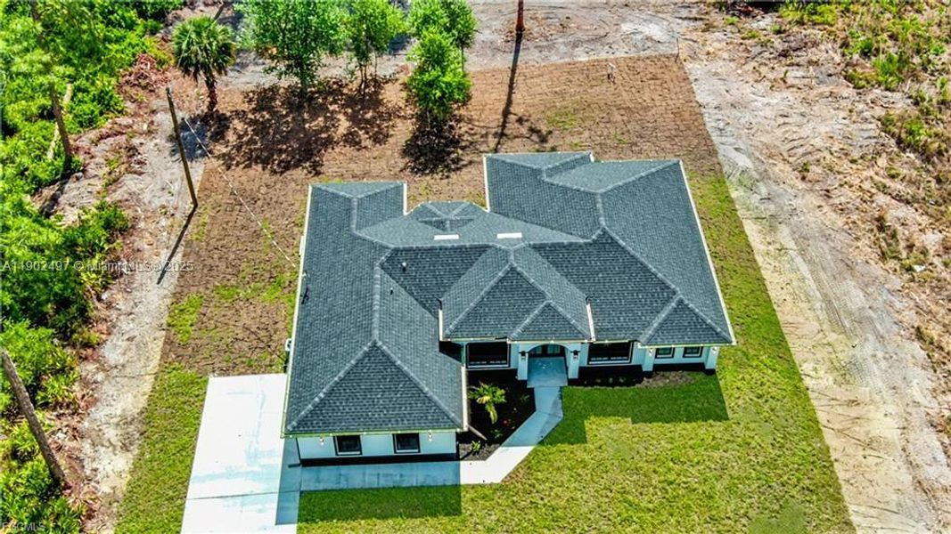 Front exterior of a new home in , Lehigh Acres, FL, highlighting curb appeal (Image 22). Front exterior of a new home in , Lehigh Acres, FL, highlighting curb appeal (Image 22).