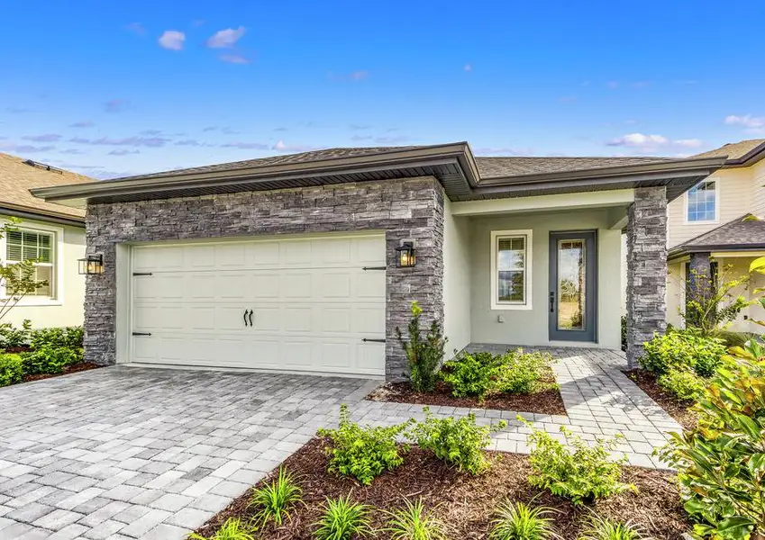 This home has a 2-car garage and gorgeous stone detailing.