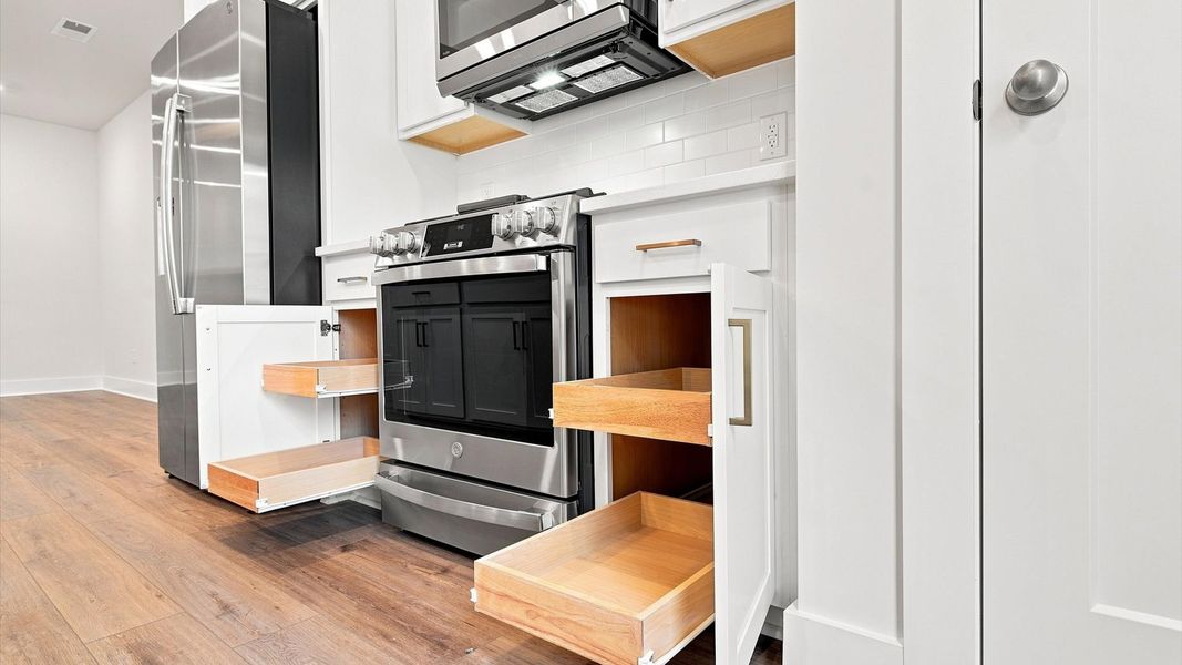 Exceptional kitchen featuring sleek cabinetry, ample storage, and modern finishes by DRB Homes Exceptional kitchen featuring sleek cabinetry, ample storage, and modern finishes by DRB Homes