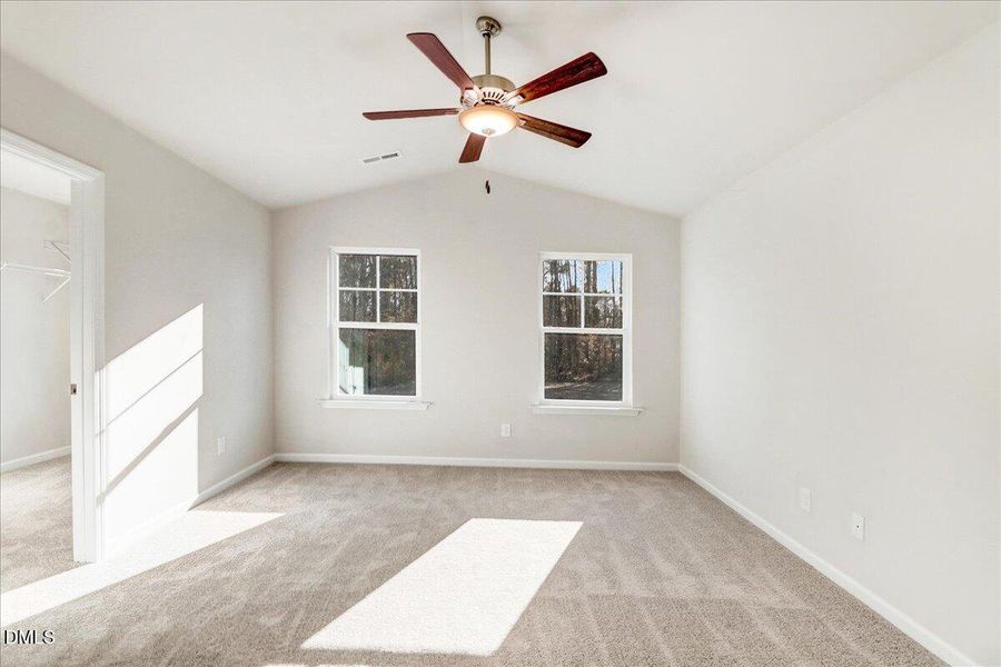 28-Primary bedroom with ceiling fan in N