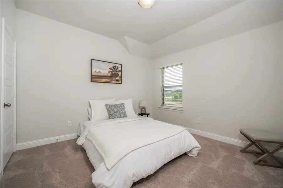 Secondary bedroom has a walk in closet.