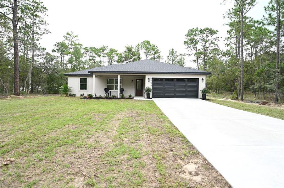 Front exterior of a new home in , Dunnellon, FL, highlighting curb appeal (Image 23).