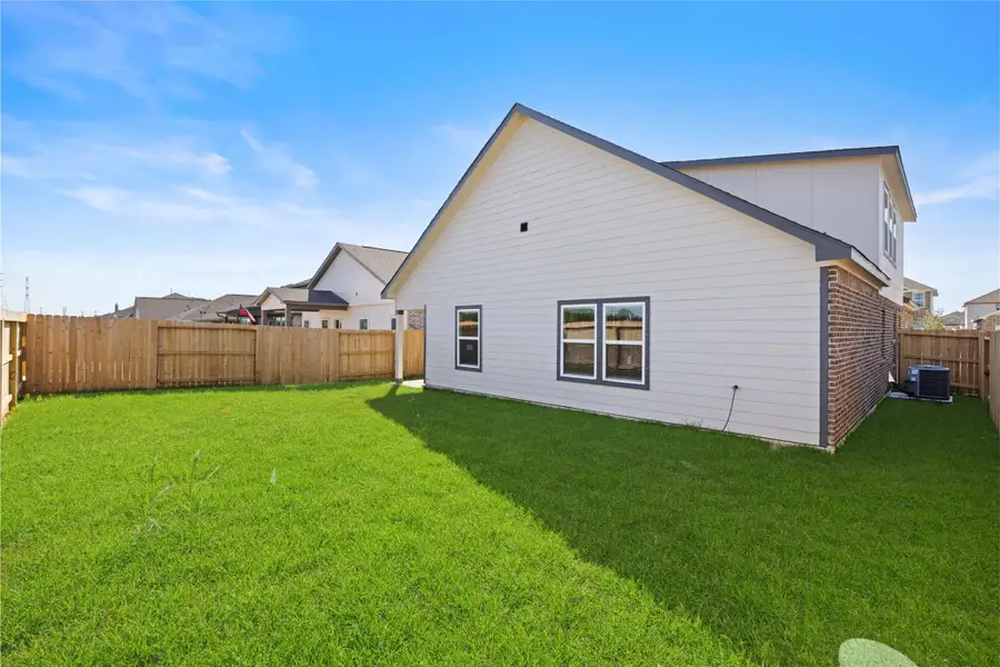 Exterior details and patio area of a home in Kendall Lakes, Alvin (Image 3). Exterior details and patio area of a home in Kendall Lakes, Alvin (Image 3).