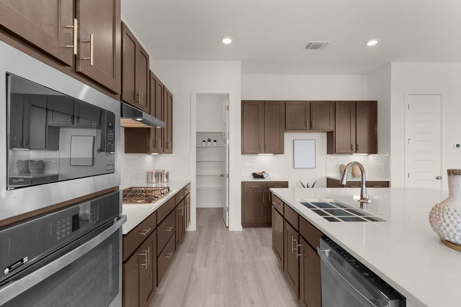 Representative furnished interior of a home built from the Maeve by Chesmar Homes in Deerbrooke Cottages, Leander (Image 8).