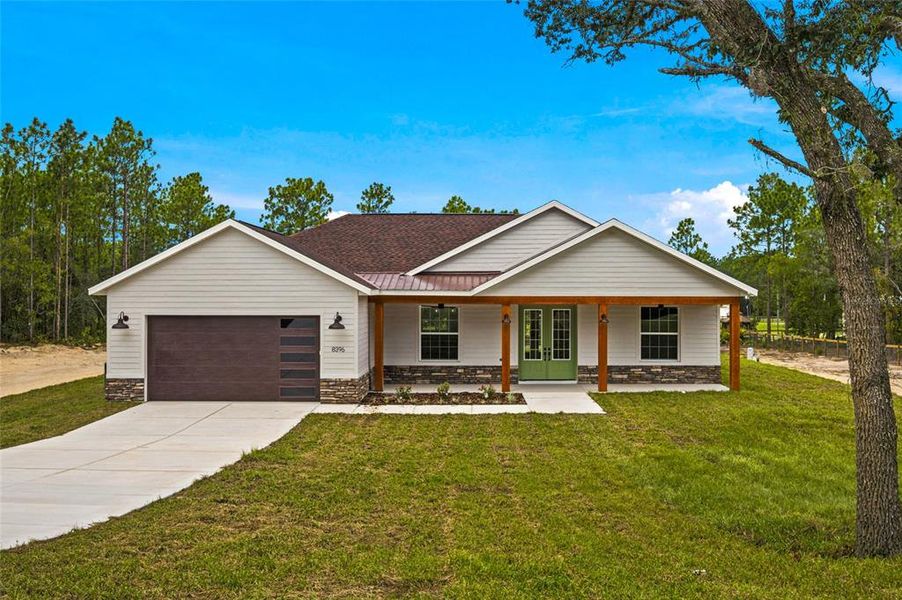 Front exterior of a new home in , Dunnellon, FL, highlighting curb appeal (Image 2). Front exterior of a new home in , Dunnellon, FL, highlighting curb appeal (Image 2).