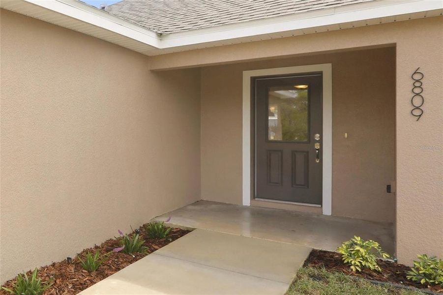 Exterior details and patio area of a home in , Sebring (Image 3).