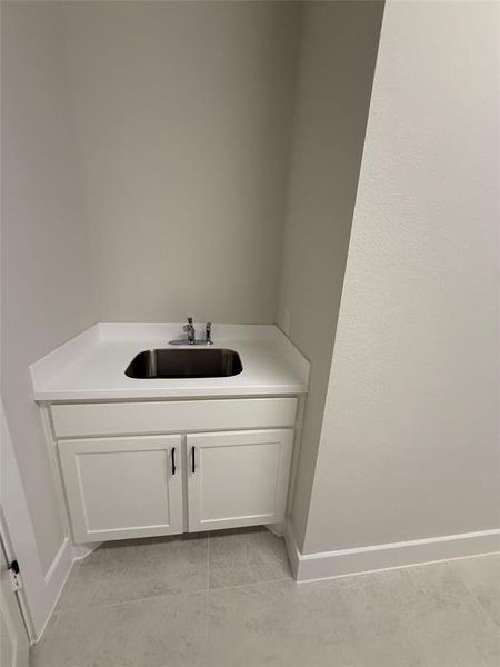 Bathroom featuring vanity and light tile patterned floors Bathroom featuring vanity and light tile patterned floors