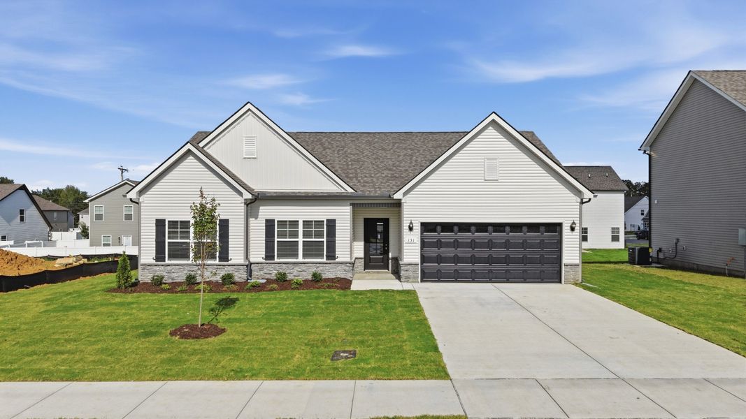Front exterior of a new home in Wheatfield, Shelbyville, TN, highlighting curb appeal (Image 20).