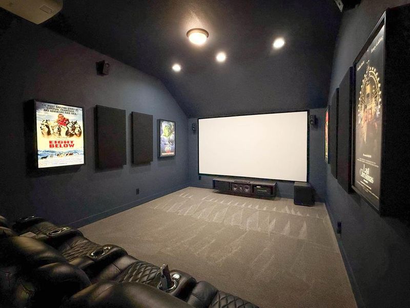 Carpeted cinema room featuring lofted ceiling and recessed lighting Carpeted cinema room featuring lofted ceiling and recessed lighting