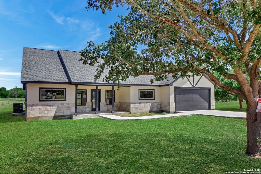 Front exterior of a new home in , Lytle, TX, highlighting curb appeal (Image 26). Front exterior of a new home in , Lytle, TX, highlighting curb appeal (Image 26).