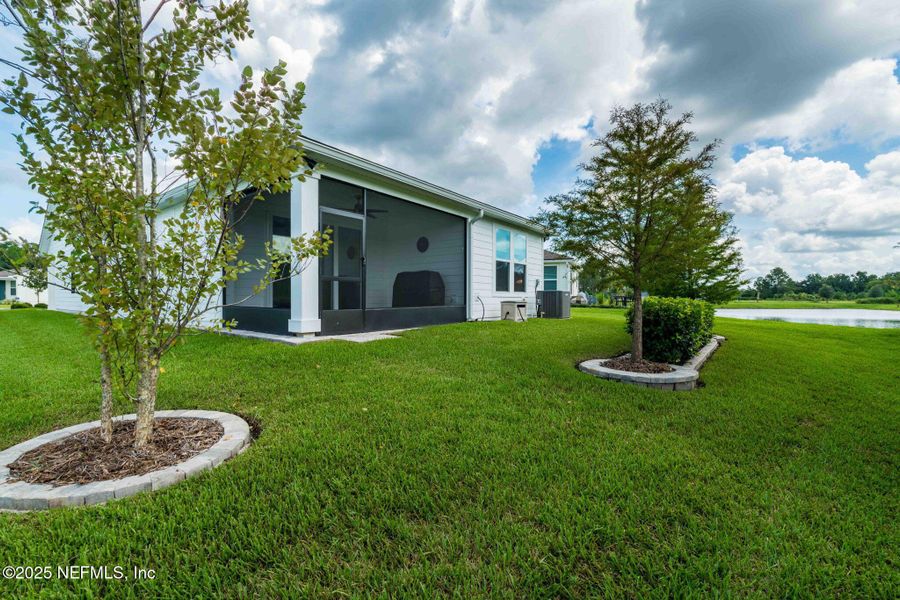 Front exterior of a new home in Summer Bay at Grand Oaks, St. Augustine, FL, highlighting curb appeal (Image 1). Front exterior of a new home in Summer Bay at Grand Oaks, St. Augustine, FL, highlighting curb appeal (Image 1).