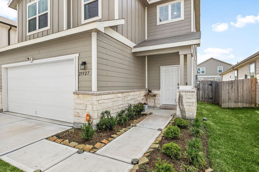 Front exterior of a new home in Decker Farms, Magnolia, TX, highlighting curb appeal (Image 1). Front exterior of a new home in Decker Farms, Magnolia, TX, highlighting curb appeal (Image 1).