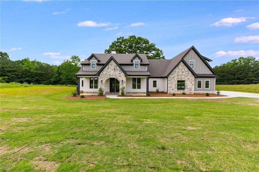 Front exterior of a new home in The Meadows at Lake Circle, Buchanan, GA, highlighting curb appeal (Image 1).