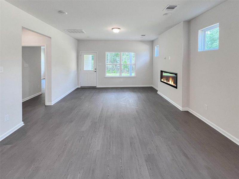 The Robin II- Family Room with Linear Electric Fireplace. Sample image to be used for example only.