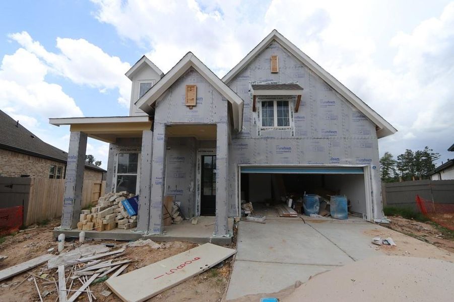 Front exterior of a new home in ARTAVIA 45' Homesites, Conroe, TX, highlighting curb appeal (Image 2).