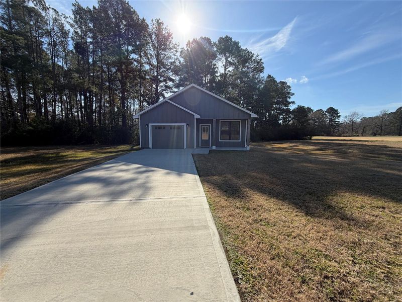 Front exterior of a new home in , Trinity, TX, highlighting curb appeal (Image 20).