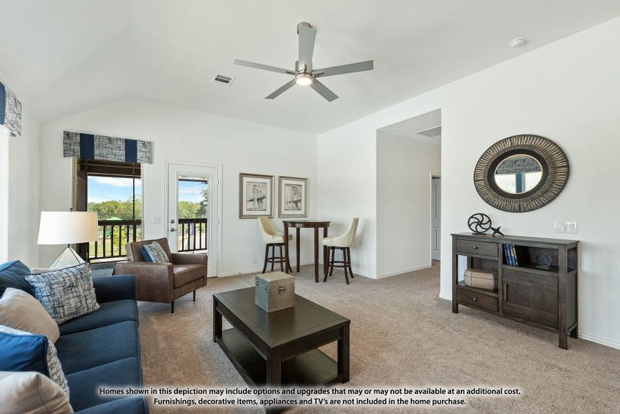 Living room with vaulted ceiling, ceiling fan, blue sofa, and sliding doors to a balcony Living room with vaulted ceiling, ceiling fan, blue sofa, and sliding doors to a balcony