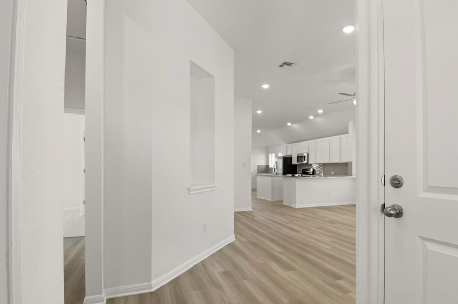 Hallway featuring recessed lighting and light wood finished floors