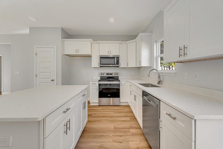 Furnished interior view inside a new home in Live Oak Cottages, Freeport (Image 7).