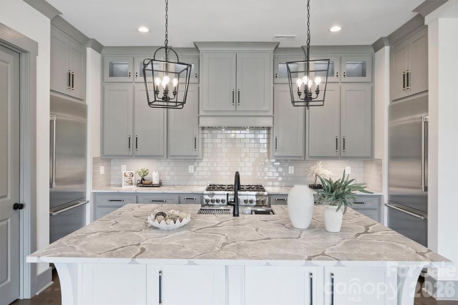 Oversized Island with Beautiful leathered Quartz countertops and Underneath Storage Oversized Island with Beautiful leathered Quartz countertops and Underneath Storage