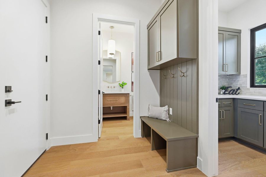 Mudroom with light wood finished floors