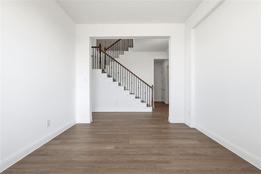 Entrance foyer with dark wood-type flooring and stairway Entrance foyer with dark wood-type flooring and stairway