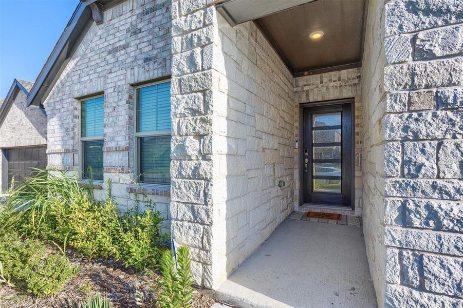 View of exterior entry with stone siding View of exterior entry with stone siding