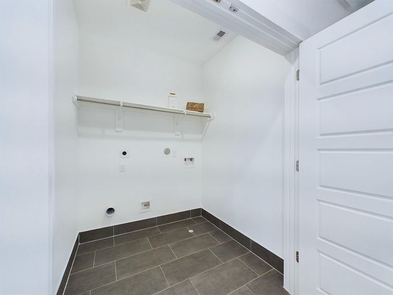 Laundry room conveniently located on the second floor. Laundry room conveniently located on the second floor.