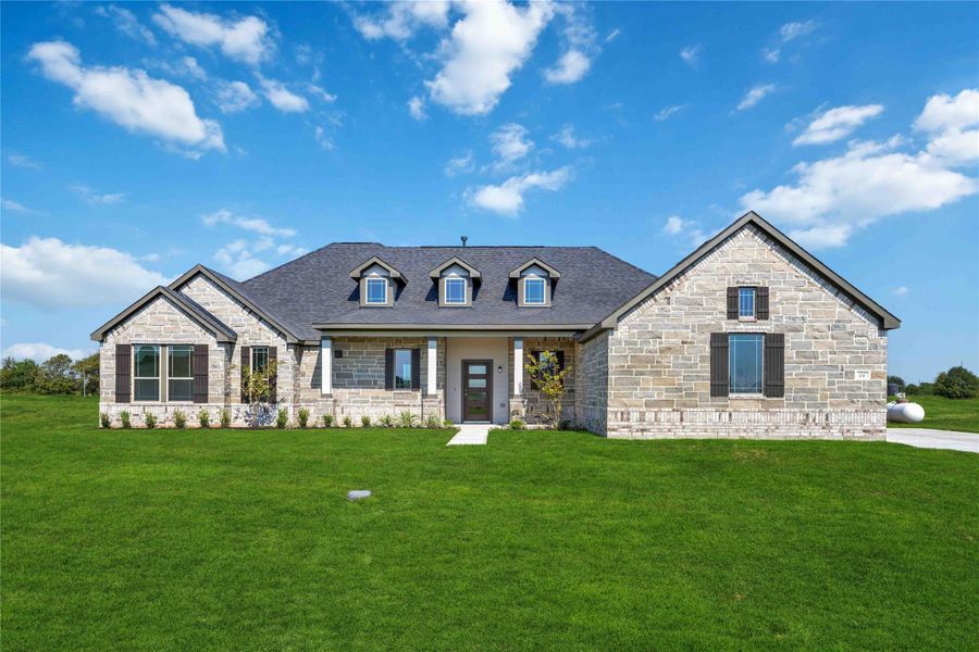 Front exterior of a new home in Blue Heron Estates, Beasley, TX, highlighting curb appeal (Image 13).