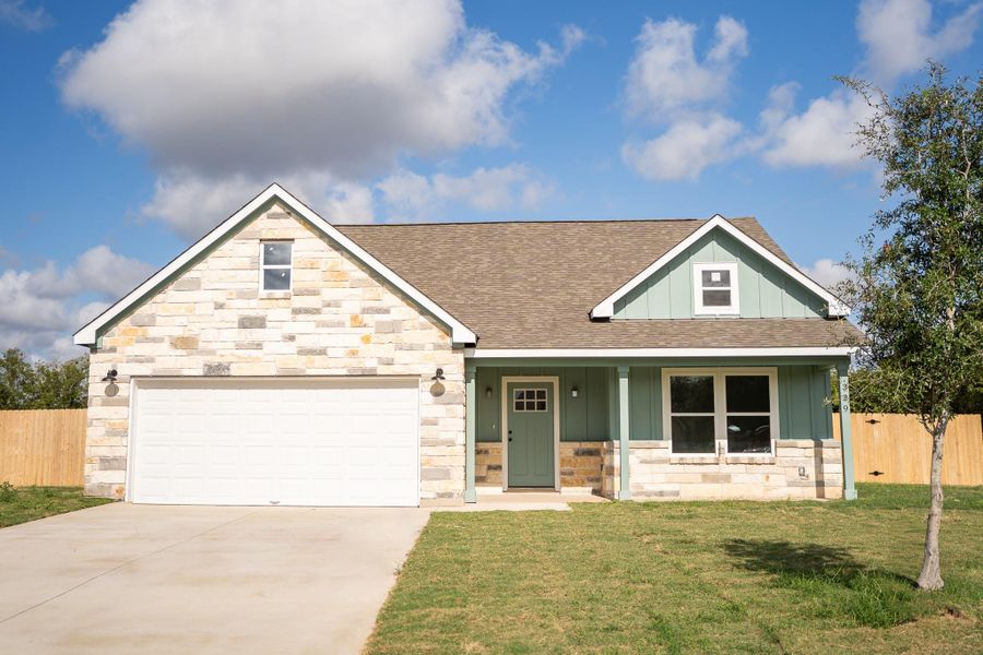 Front exterior of a new home in , Smithville, TX, highlighting curb appeal (Image 19).