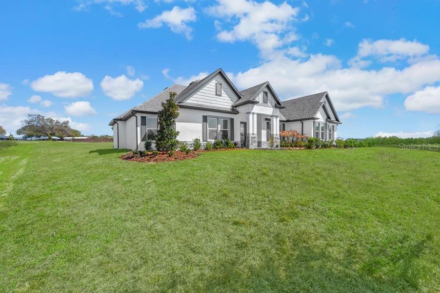 Front exterior of a new home in , Fruitland Park, FL, highlighting curb appeal (Image 2). Front exterior of a new home in , Fruitland Park, FL, highlighting curb appeal (Image 2).