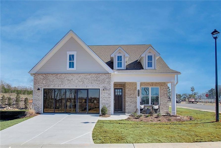 Front exterior of a new home in Courtyards at Traditions, Cumming, GA, highlighting curb appeal (Image 22).