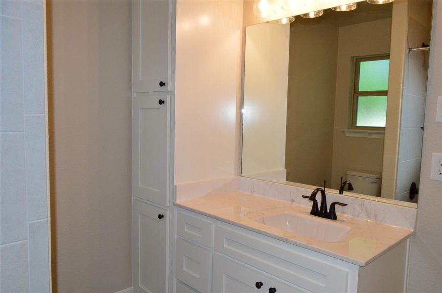 Bathroom with vanity and toilet