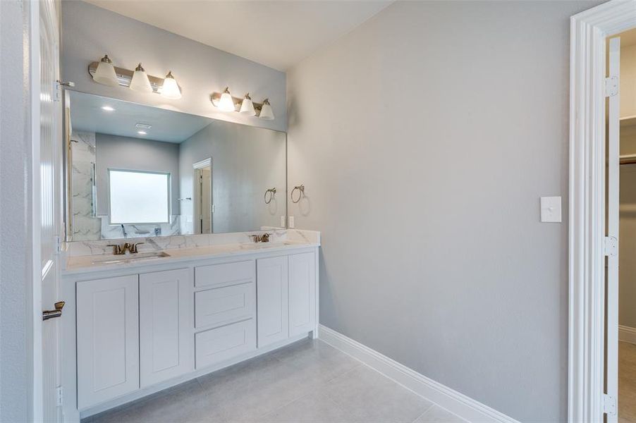 Bathroom with vanity and tile patterned flooring