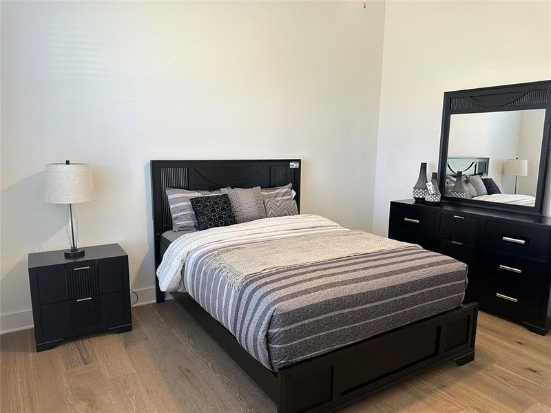 Light wood-finish flooring provides a neutral base to this room