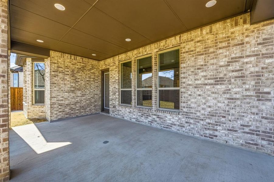 Exterior details and patio area of a home in Wildridge, Oak Point (Image 19).
