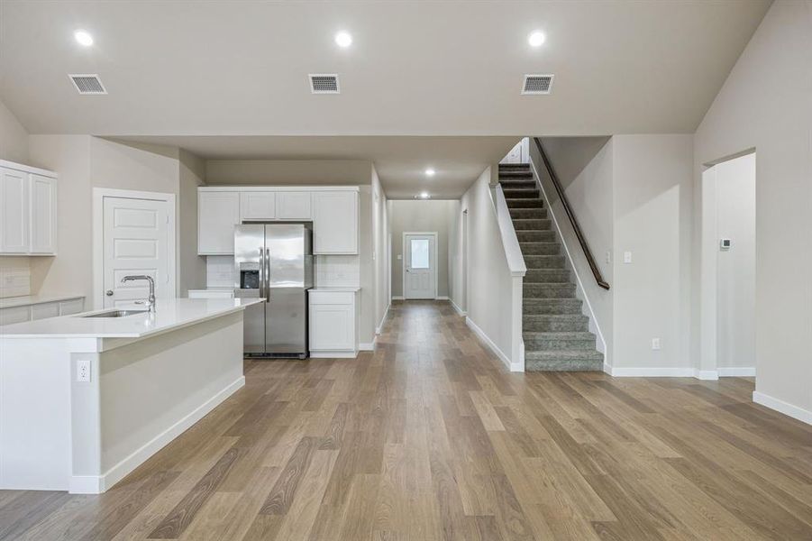 Open First Floor in the Wimbledon home plan by Trophy Signature Homes – REPRESENTATIVE PHOTO Open First Floor in the Wimbledon home plan by Trophy Signature Homes – REPRESENTATIVE PHOTO
